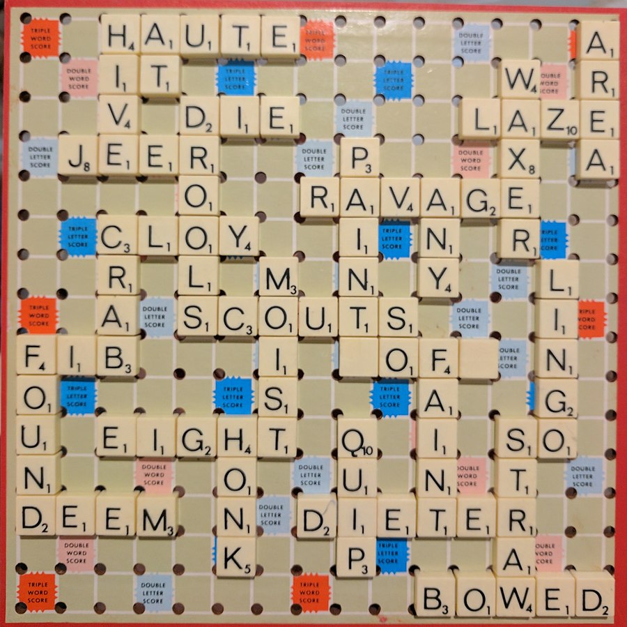 A Scrabble board features mostly boring words such as "cloy," "deem," and "lingo"