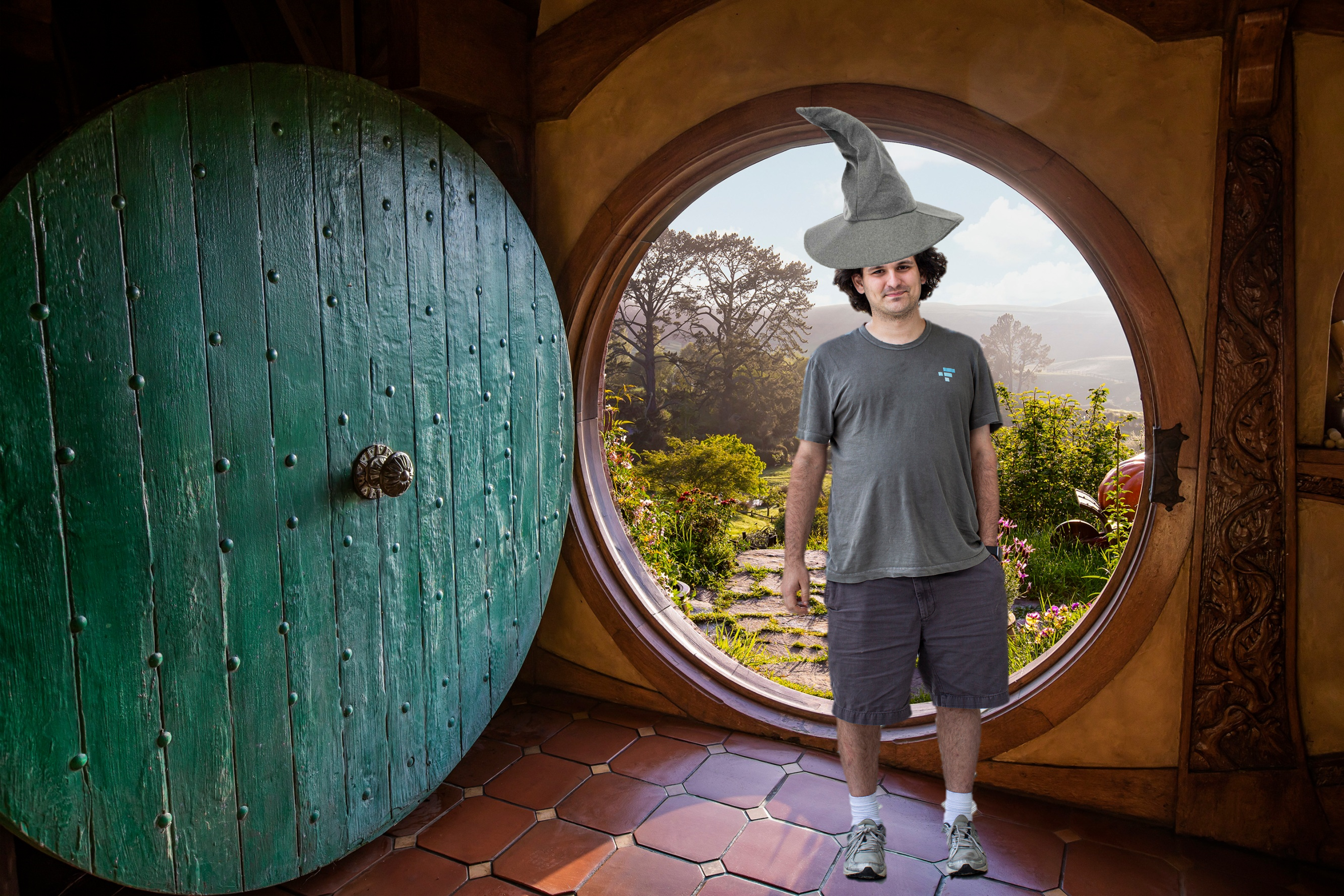 a young man (Sam Bankman-Fried) in grey shorts, tshirts and a wizard hat standing inside a hobbit house with a green open door behind him